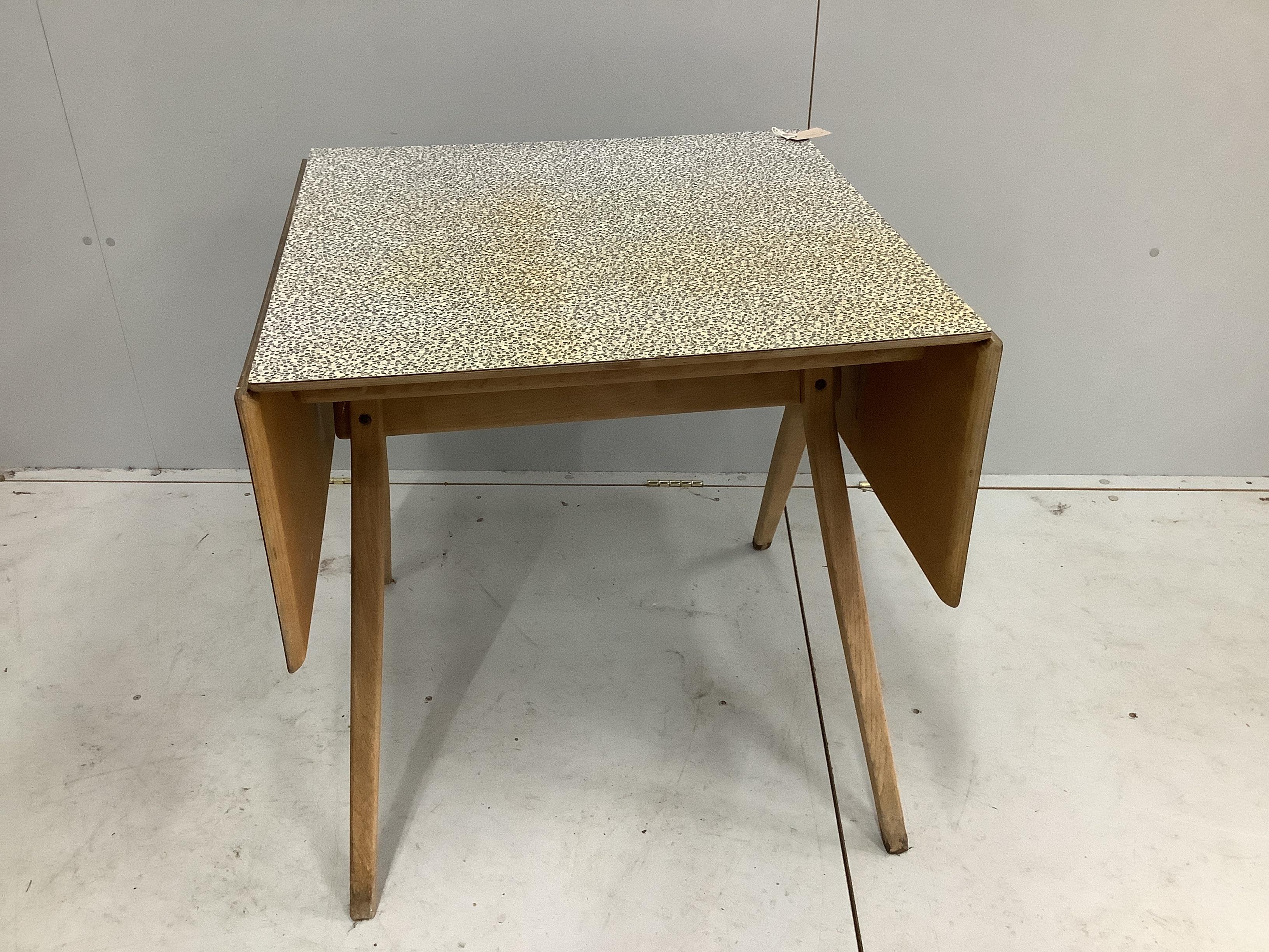 A mid century oak and melamine drop flap dining table, width 70cm, depth 68cm, height 73cm together with a Parker Knoll teak two tier occasional table